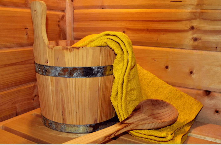 wooden sauna and yellow towel 