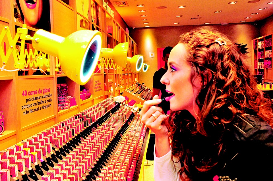 woman using lipstick