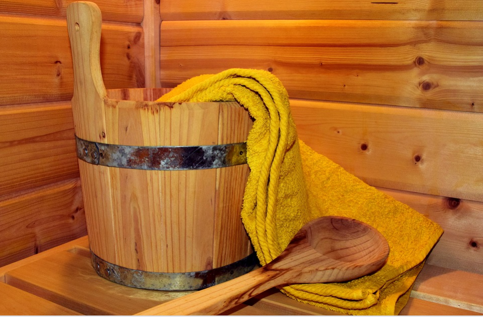 wooden sauna and yellow towel 