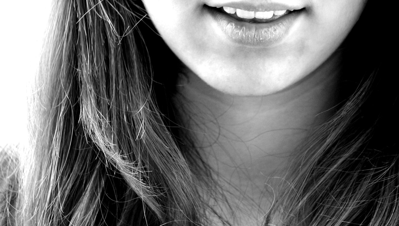 black and white smiling woman